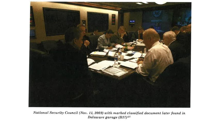 This image from Special Council Robert Hur’s investigation released by the Department of Justice on Thursday, February 8, 2024 shows Joe Biden attending a National Security Council meeting with a classified document that was later found in his Delaware garage.