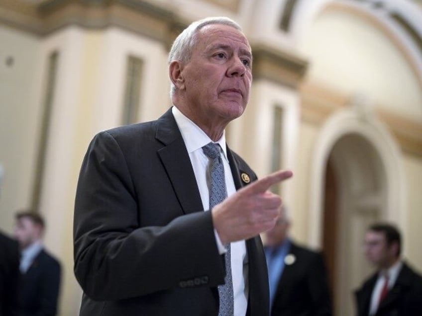 Rep. Ken Buck (R-CO) walks out of the House chamber at the Capitol in Washington, February