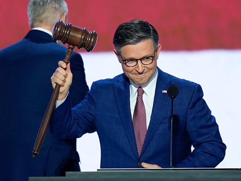 Speaker of the House Mike Johnson, R-La., holding up the gavel on the first day of the Rep