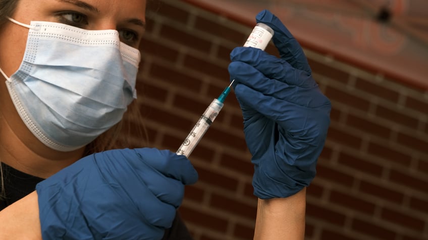 Nurse preparing a COVID vaccine