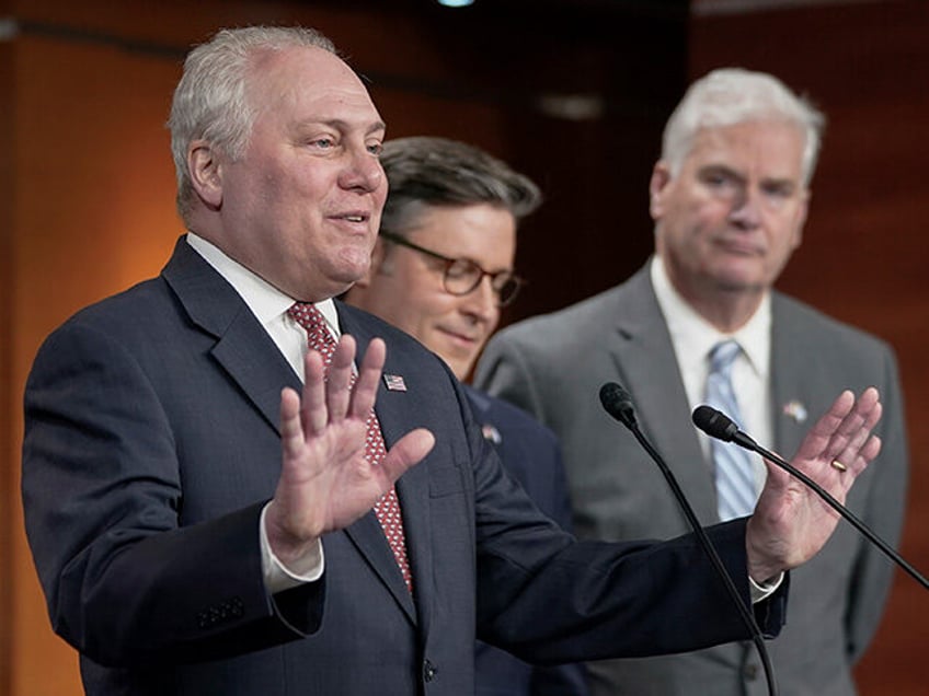 Rep. Steve Scalise, R-La, left, meets with reporters ahead of a crucial vote on a continuing resolution to keep the government funded at its current levels, a measure not heartily supported by the hard right wing of his party, as Rep. Tom Emmer, R-Minn., right and House Speaker Mike Johnson, …