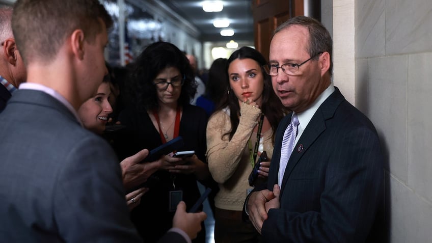 Murphy takes reporter questions in Capitol hallway