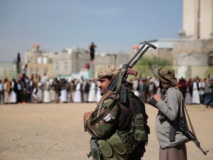 FILE - Armed Houthi fighters attend the funeral procession of Houthi rebel fighters who we