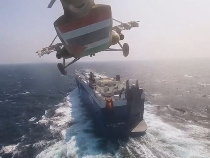 RED SEA - NOVEMBER 20: (----EDITORIAL USE ONLY - MANDATORY CREDIT - 'HOUTHIS MEDIA CENTER / HANDOUT' - NO MARKETING NO ADVERTISING CAMPAIGNS - DISTRIBUTED AS A SERVICE TO CLIENTS----) A screen grab captured from a video shows that cargo ship 'Galaxy Leader', co-owned by an Israeli company, being hijacked …