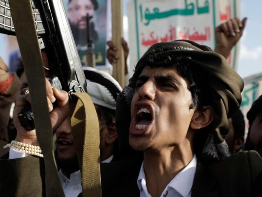 A Houthi supporter shouts slogans during an Anti- U.S and Israel rally in Sanaa, Yemen, Fr