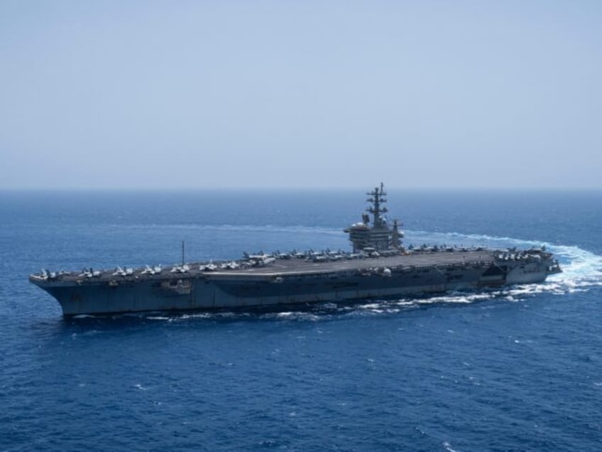 FILE - The USS aircraft carrier Dwight D. Eisenhower, also known as 'IKE', sails in the Re