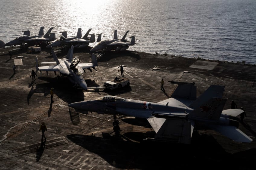 Figther jets maneuver on the deck of the USS Dwight D. Eisenhower in the Red Sea on Tuesday, June 11, 2024. (AP Photo/Bernat Armangue)