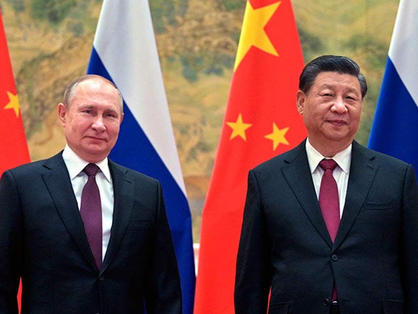 Chinese President Xi Jinping, right, and Russian President Vladimir Putin pose for a photo prior to their talks in Beijing, China, Friday, Feb. 4, 2022. Russian President Putin is expected to meet this week with Chinese leaders in Beijing on a visit that underscores China’s economic and diplomatic support for …