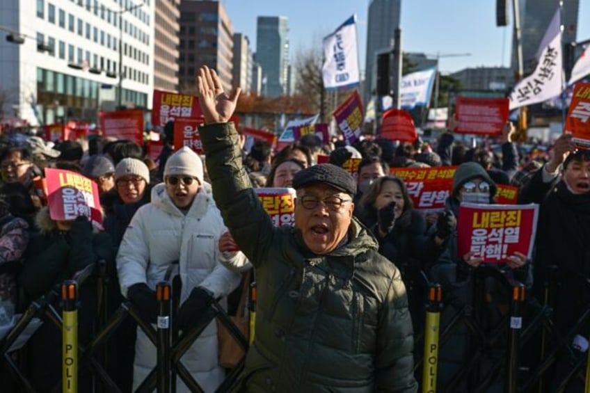 Shin Jae-hyung (C), a 66-year-old protester, also participated in South Korea's pro-democr