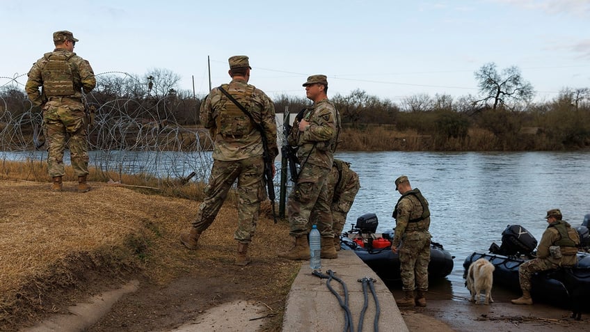 Texas National Guard on banks of Rio Grande in Eagle Pass, Texas