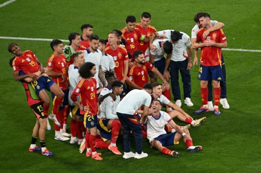 Spain's players celebrate after winning their Euro 2024 semi-final against France in Munic