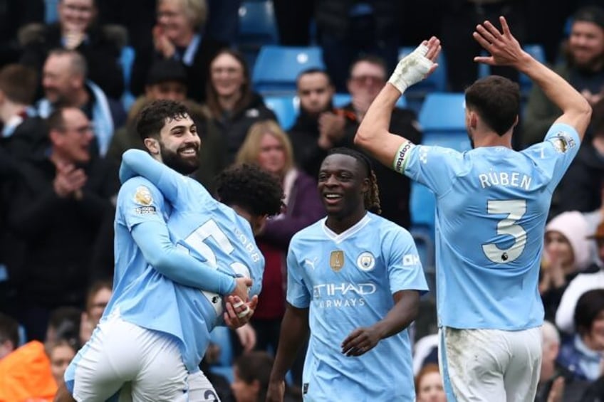 Manchester City went top of the Premier League with a 5-1 win over Luton