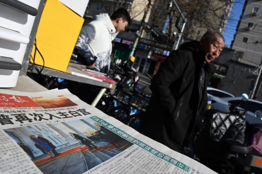 A newspaper featuring an image of Donald Trump arriving at the White House ahead of his in