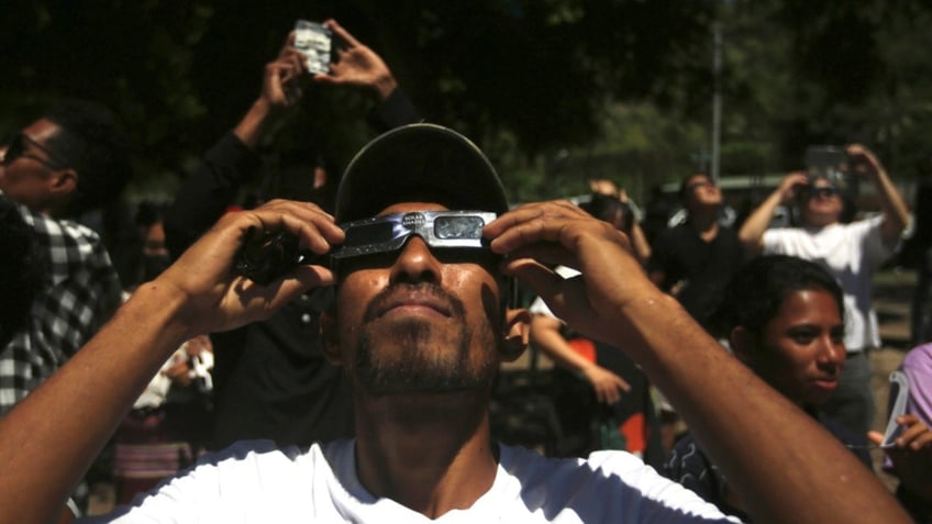 A man uses a protective glasses