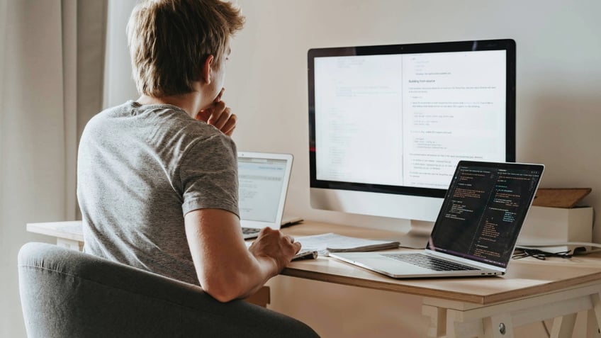 MAN working on computer