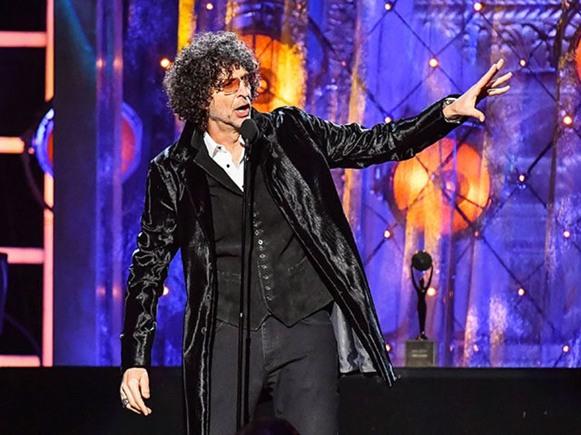 Howard Stern inducts Bon Jovi on stage during the 33rd Annual Rock & Roll Hall of Fame Ind