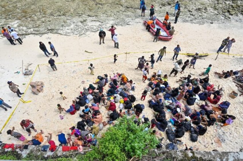 huddled on an indonesian beach stranded rohingya plead for mercy