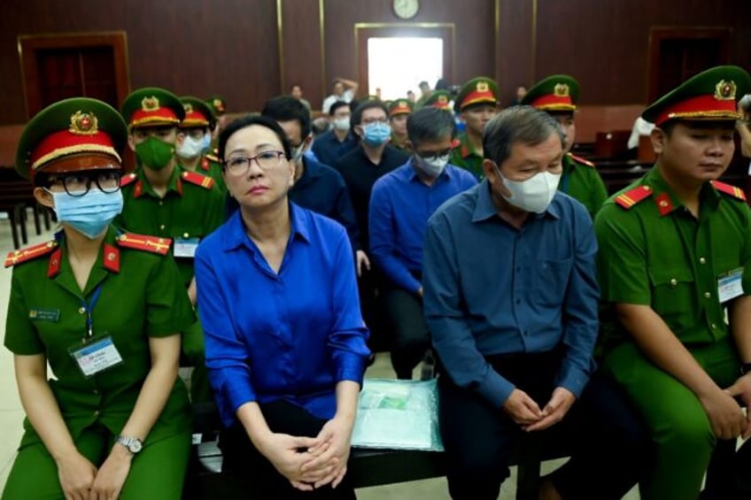 Vietnamese property tycoon Truong My Lan (2-L) is at the centre of a massive fraud case th