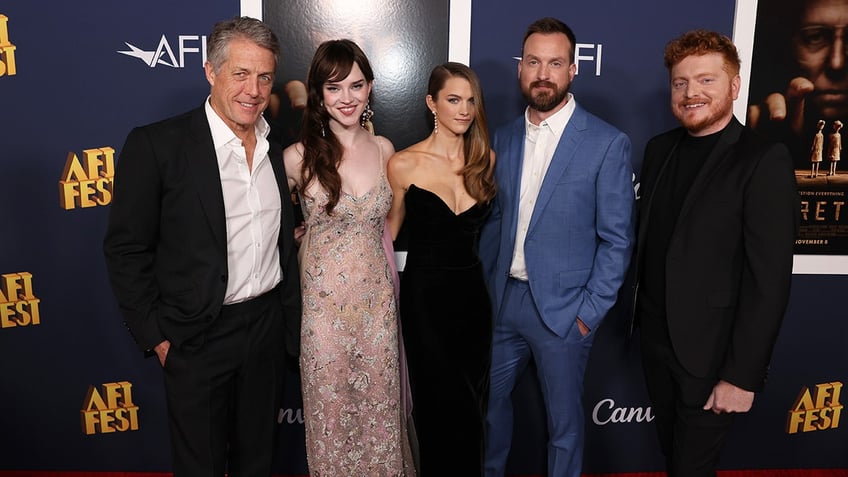 Hugh Grant, Sophie Thatcher, Chloe East, Scott Beck and Bryan Woods posing together