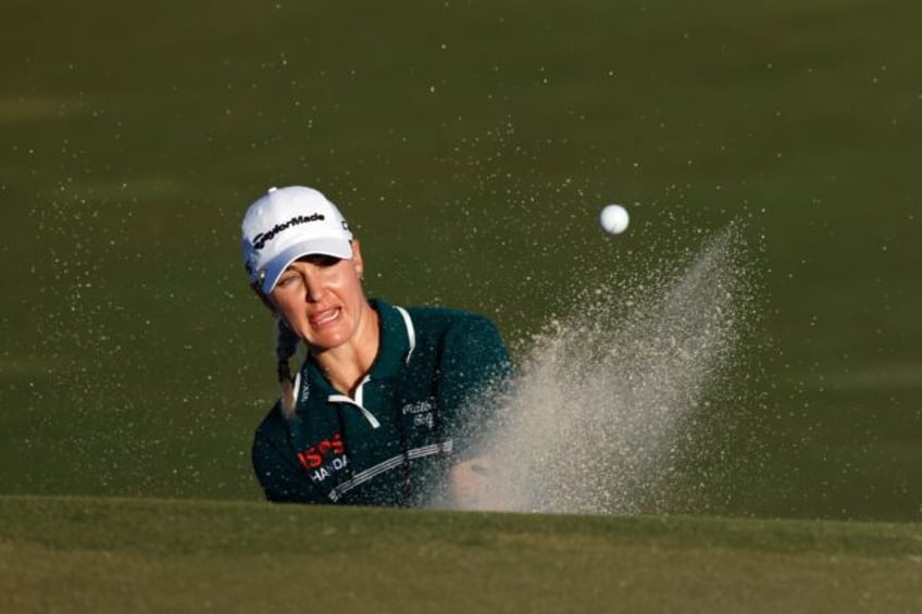 England's Charley Hull blasts out of a bunker on her way to a 68 that gave her a one-strok