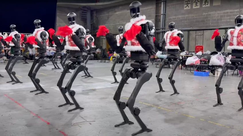 Humanoid robots bust dance moves alongside humans