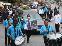 Hundreds mourn gang killings of a Haitian mission director and a young American couple