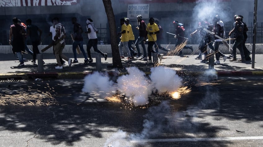 hundreds of african migrants get into mass brawl leading to blood stained streets in israel