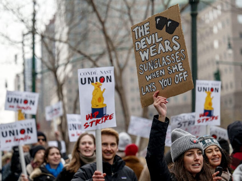 Unionized staff at Condé Nast walk the picket line during a 24 hour walk out amid layoff announcement in front of the Condé Nast offices at One World Trade Center in New York City on January 23, 2024. Conde Nast is merging the popular digital music publication Pitchfork with the …