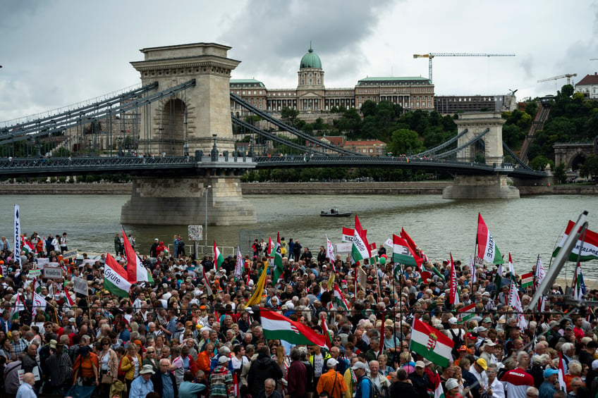 People gather during a rally in support of Hungary's Prime Minister Viktor Orbán and his party in Budapest, Hungary on Saturday, June 1, 2024. Orbán, whose 14 years in power make him the European Union's longest serving leader, has focused his campaign for the June 9 European Parliament elections on the war in Ukraine, portraying his domestic and international opponents as warmongers who seek to involve Hungary directly in the conflict. (AP Photo/Denes Erdos)