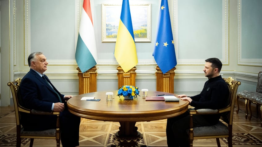 Volodymyr Zelenskyy, right, and Hungarian Prime Minister Viktor Orban hold a meeting