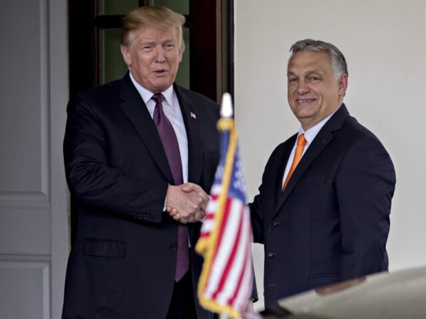 U.S. President Donald Trump, left, shakes hands with Viktor Orban, Hungary's prime ministe