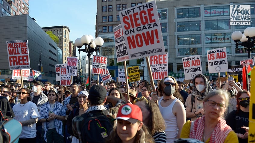 Anti-Israel protesters hold signs and march through Manhattan