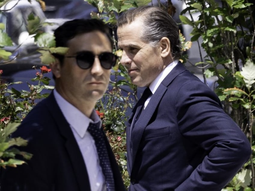 Hunter Biden, son of President Joe Biden, right, exits federal court in Wilmington, Delaware on Wednesday, July 26, 2023. A hearing over Hunter Biden's plea agreement with prosecutors regarding his tax crimes, drug offenses and a firearm violation ended today without a resolution, after a judge refused to sign off on the terms of the deal. (Hannah Beier/Bloomberg via Getty)