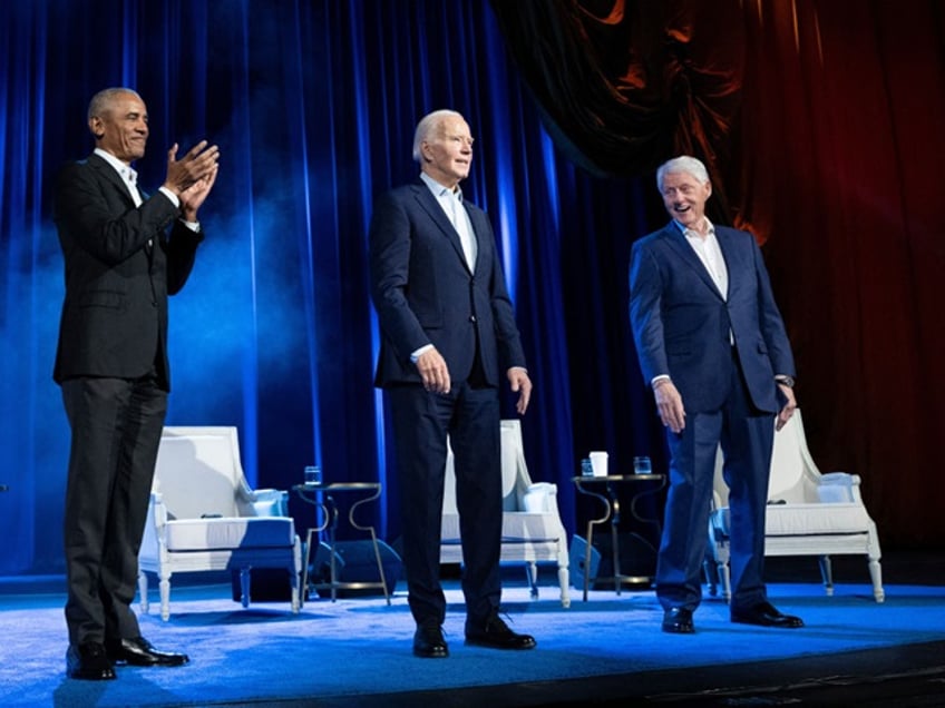 TOPSHOT - Former US President Barack Obama (L) and former US President Bill Clinton (R) cheer for US President Joe Biden during a campaign fundraising event at Radio City Music Hall in New York City on March 28, 2024. (Photo by Brendan Smialowski / AFP) (Photo by BRENDAN SMIALOWSKI/AFP via Getty Images)