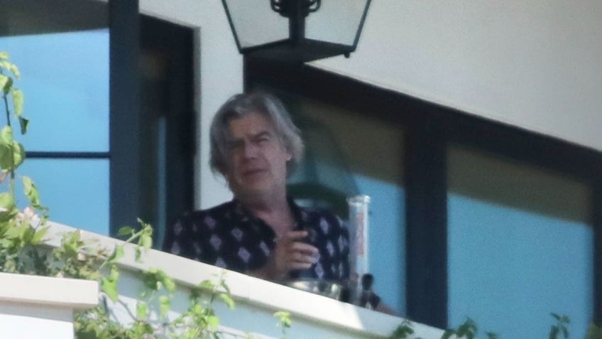 hunter bidens sugar brother lawyer spotted smoking bong on home balcony during visit from presidents son