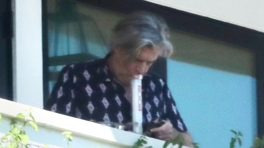 hunter bidens sugar brother lawyer spotted smoking bong on home balcony during visit from presidents son