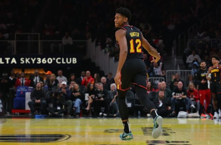 De'Andre Hunter of the Atlanta Hawks reacts after a three-point basket in an NBA victory o