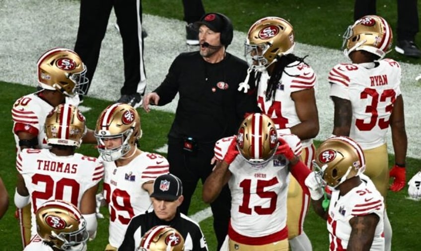 San Francisco 49ers' head coach Kyle Shanahan speaks with his players during their Super B