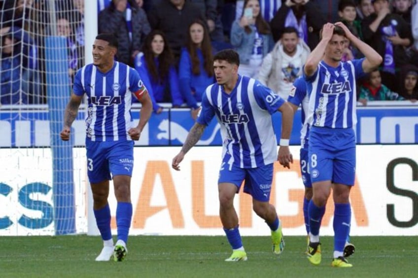 Alaves' Uruguayan midfielder Carlos Benavidez celebrates scoring the opening goal against