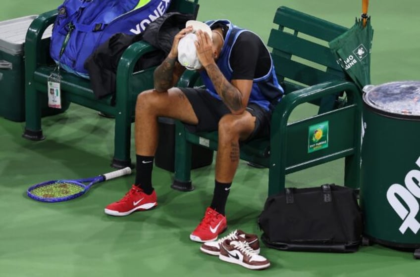 Australian Nick Kyrgios shows his dejection after retiring from his first-round match at I