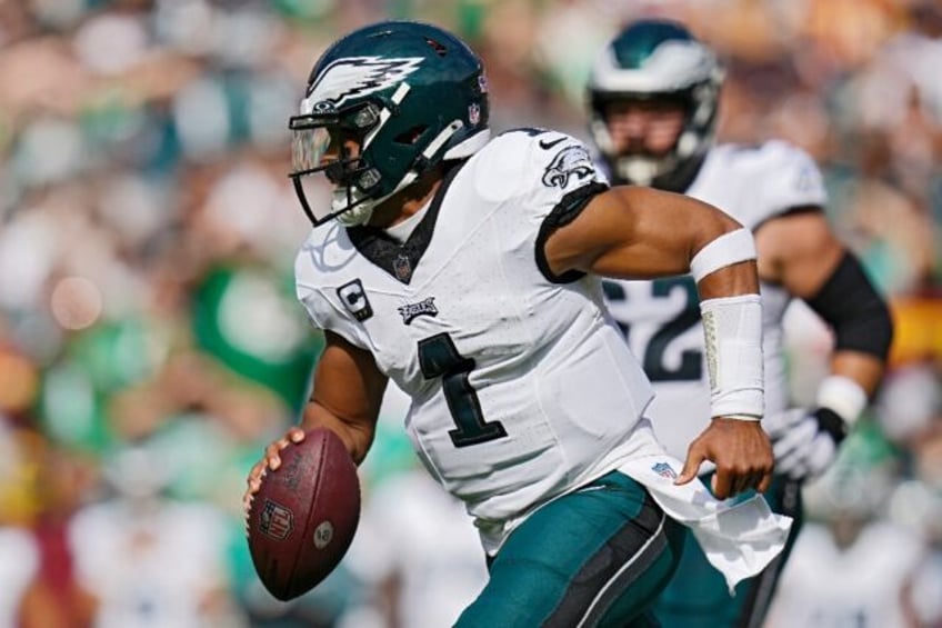 hurts sparks eagles over washington dallas rips rams in nfl