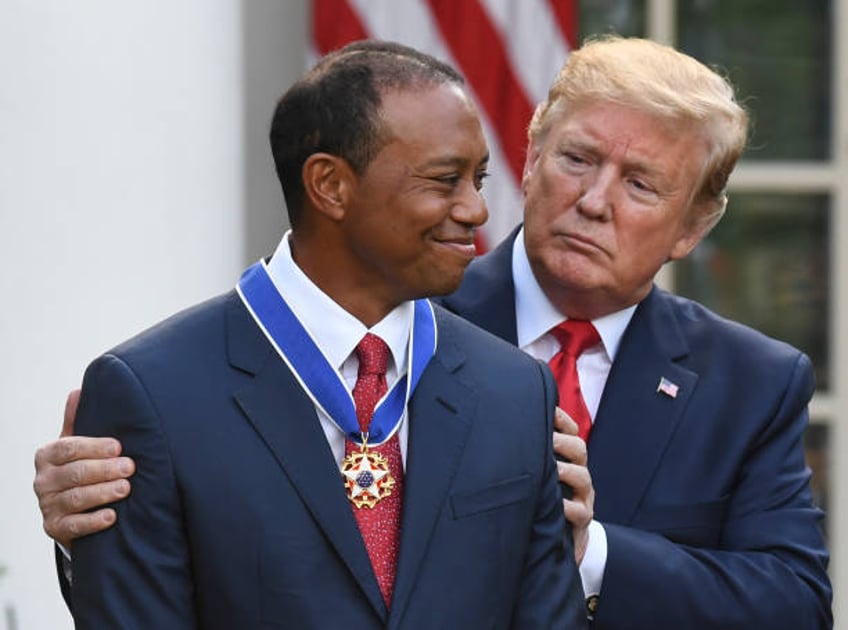 President Donald Trump presents US golfer Tiger Woods with the Presidential Medal of Freedom during a ceremony in the Rose Garden of the White House...