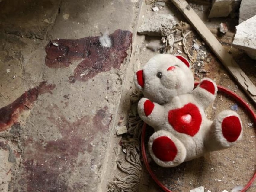 Teddy Bear at crime scene. (AP File Photo/Hadi Mizban)