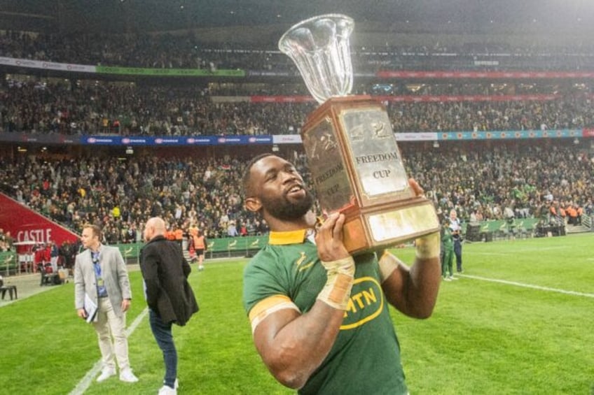 South Africa captain Siya Kolisi holds aloft the Freedom Cup after the Springboks beat New