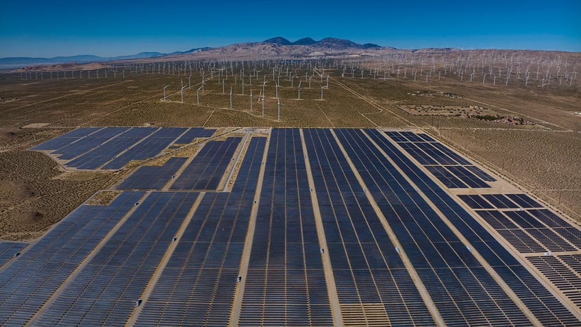 wind and solar panels merge in desert alternative energy site in Mojave, CA. . (Photo by: Visions of America/Joe Sohm/Universal Images Group via Getty Images)