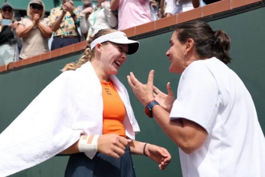 Russian Mirra Andreeva celebrates with coach Conchita Martinez after beating Aryna Sabalen