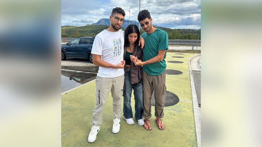 Siblings llay (Left), Yaela, (center) and Evyatar David (Right) pose for a picture during happier times for the family.