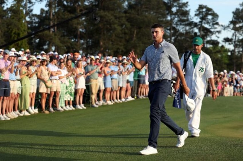 Sweden's Ludvig Aberg of Sweden acknowledges the crowd as he walks off the 18th green duri