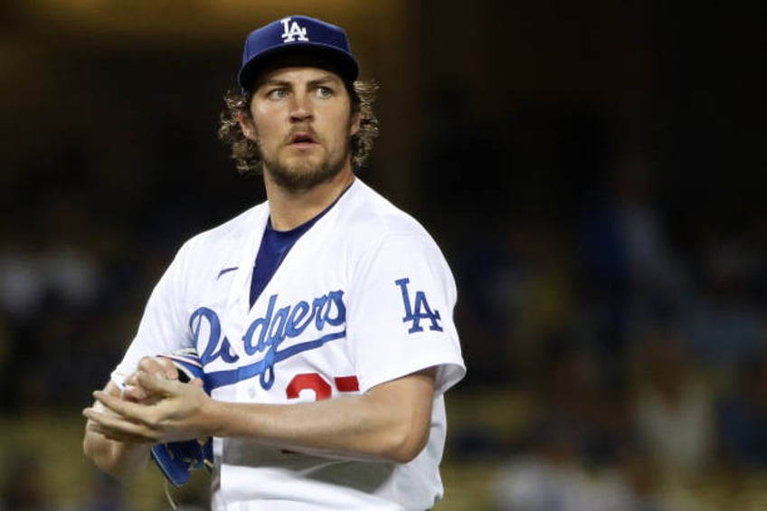 Trevor Bauer of the Los Angeles Dodgers looks on after giving up a hit to Joey Gallo of the Texas Rangers during the fifth inning at Dodger Stadium...