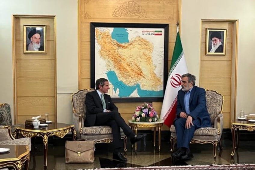 UN nuclear chief Rafael Grossi (L) speaks with Atomic Energy Organization of Iran spokesma